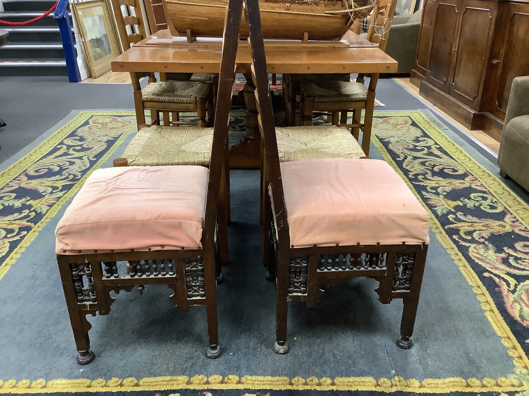 A pair of Liberty-style Moorish hardwood side chairs.